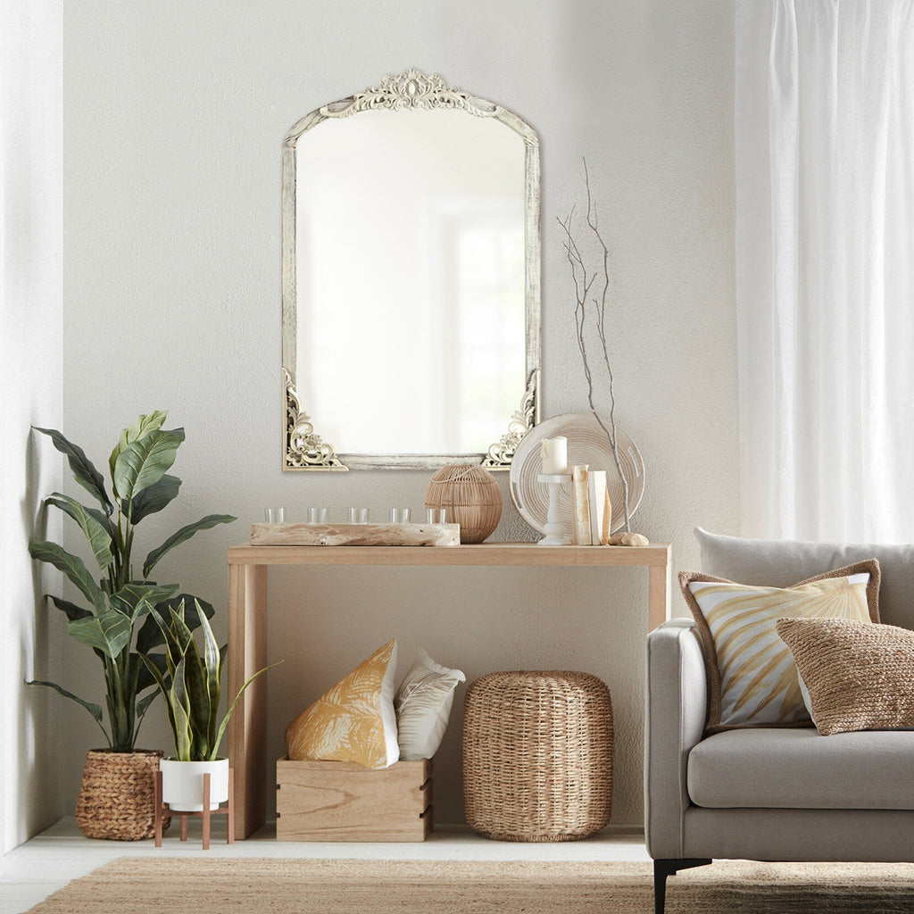 Miroir sur pied arqué en bois massif sculpté