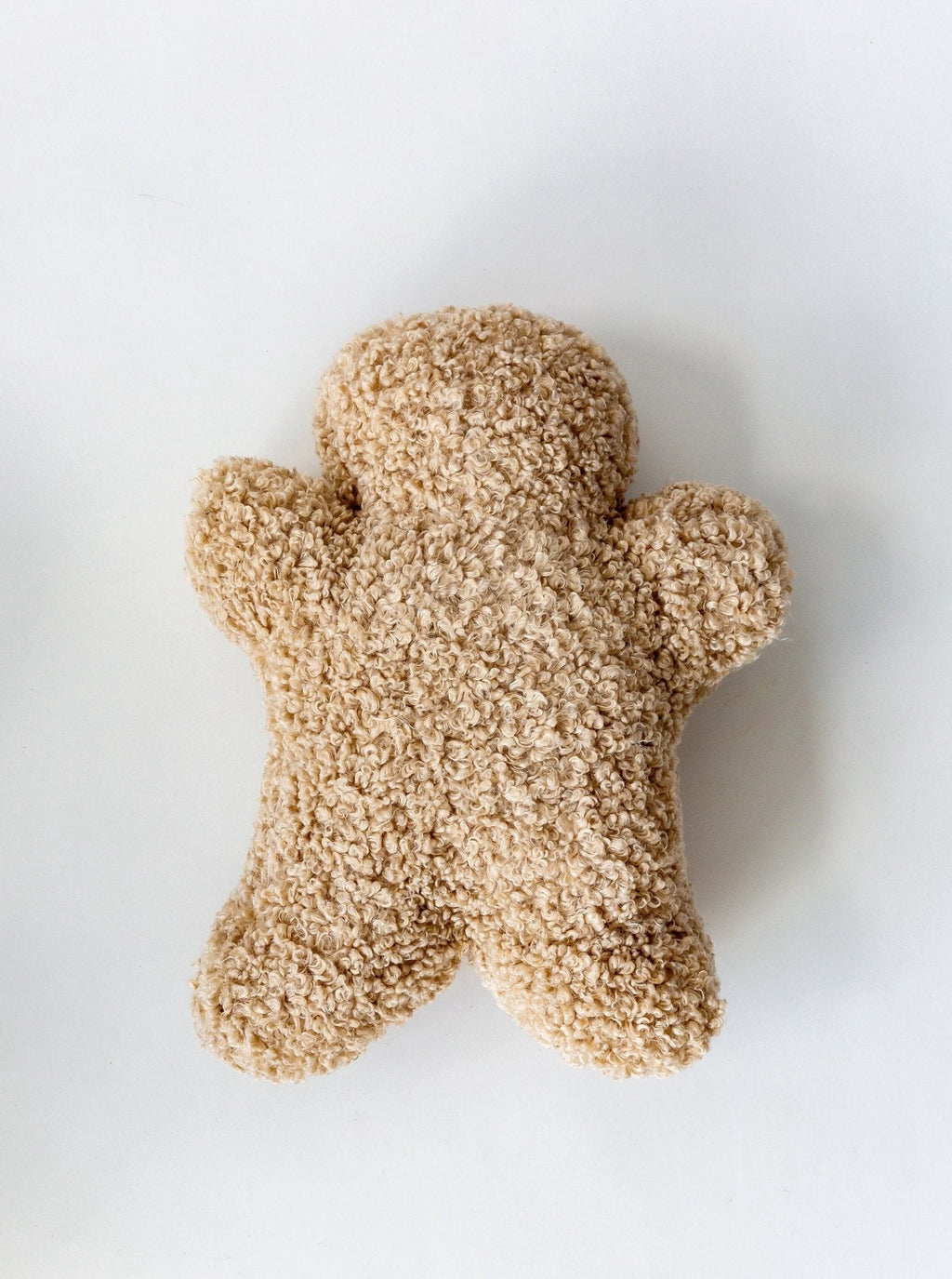 Oreiller en pain d'épice bouclé